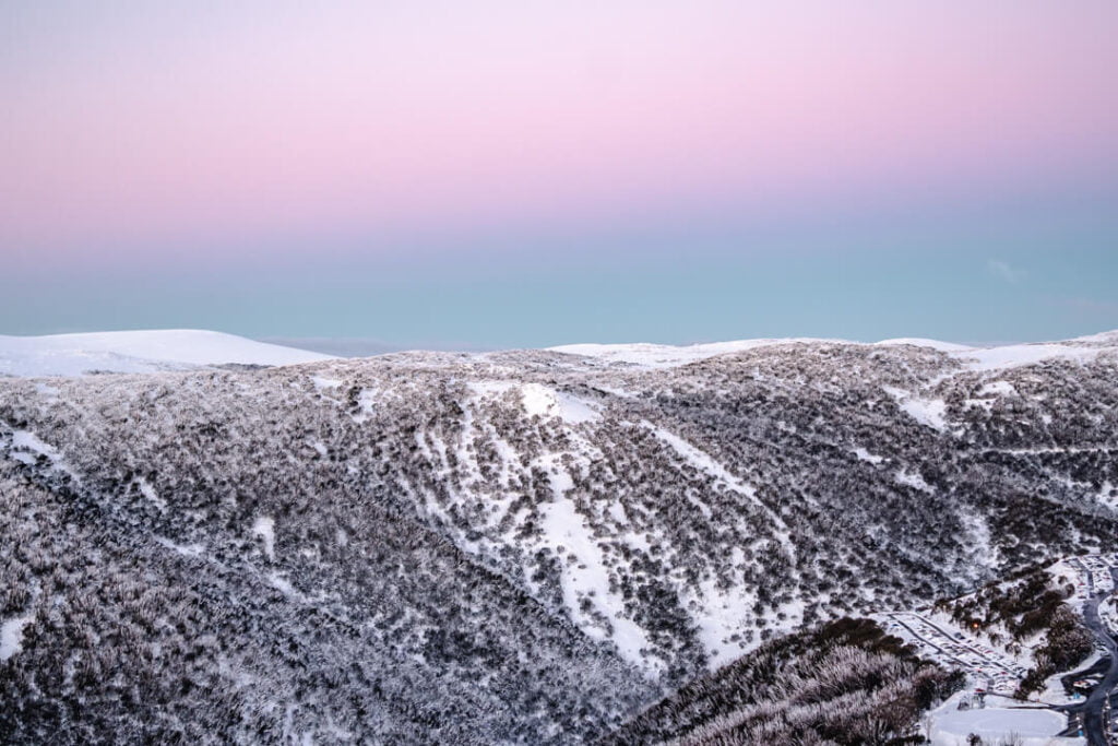 Sunset at Falls Creek - pastel pink and blue sky over mountains and village