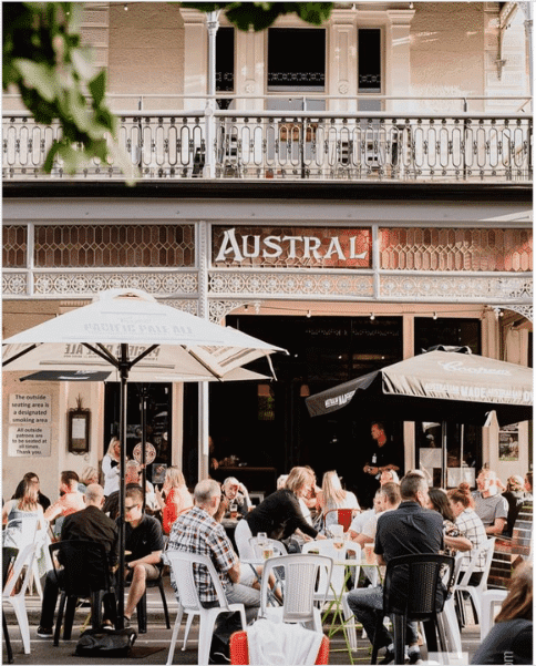 Best Adelaide Pubs with vegan options - The Austral - outside of pub with people sitting and drinking beer.