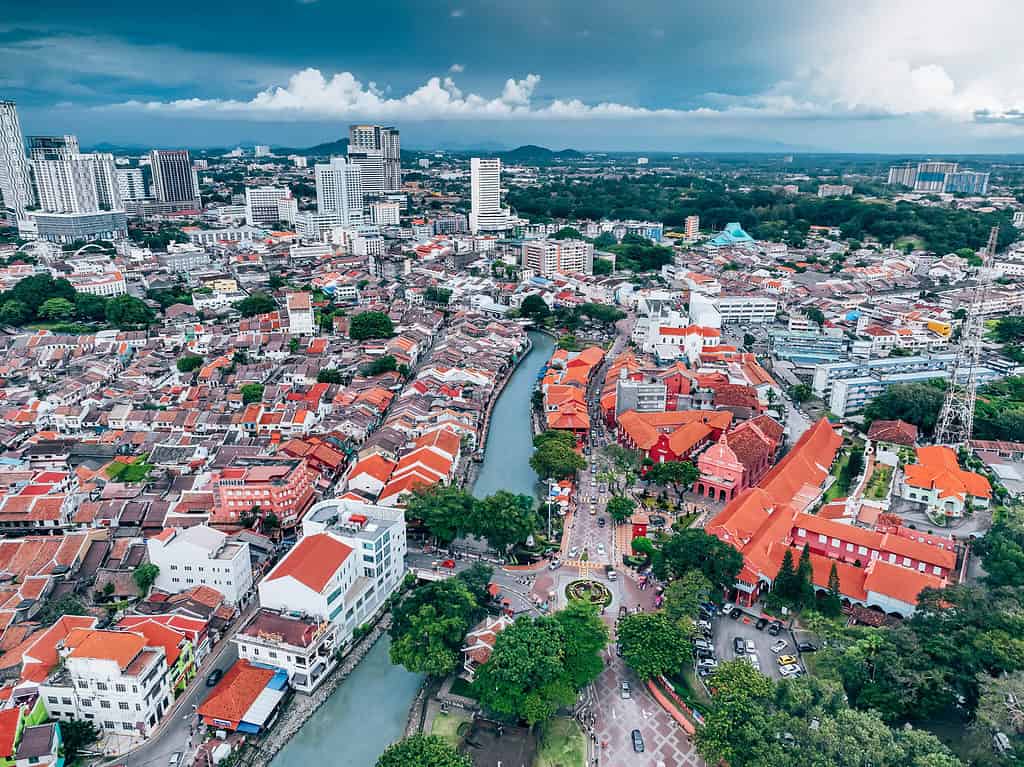 Drone aerial view of Melaka showing river & historical district - UNESCO Heritage City