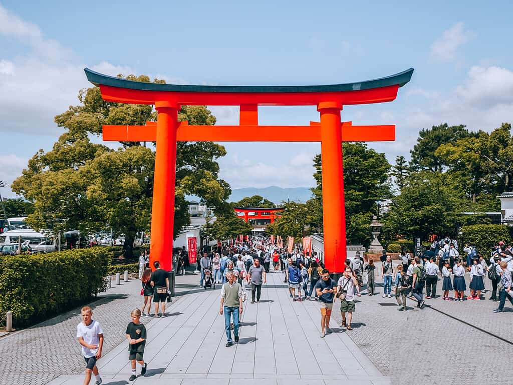 Kyoto torii gate - huge red gate with tourists walking