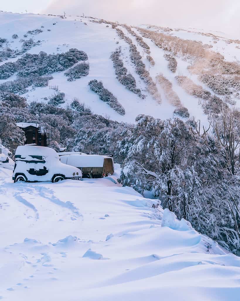 Snow in Australia - Winter scene with cars and ski slopes - Falls Creek